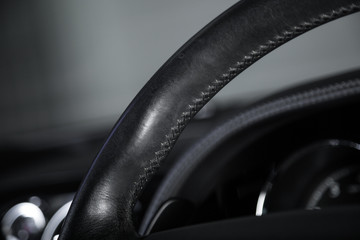 Close up of stitching on car steering wheel