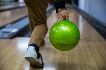 Fototapeta premium Man's hand holding a bowling ball ready to throw it