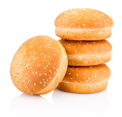 Four hamburger buns with sesame isolated on white background