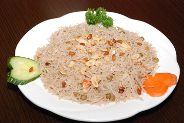 rice with vegetables and meat, seasoned with pine nuts and spices