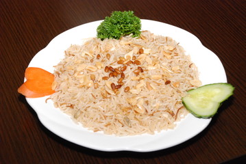 rice with vegetables and meat, seasoned with pine nuts and spices