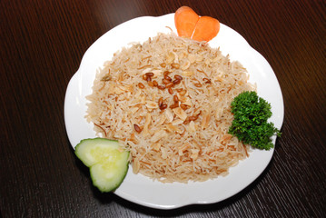 rice with vegetables and meat, seasoned with pine nuts and spices