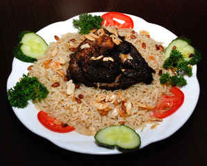 rice with vegetables and meat, seasoned with pine nuts and spices
