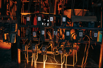 Inside of old abandoned factory. Rusty  industrial tanks cables, and pipes