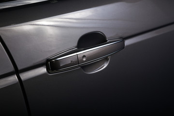 Close up of door handle on black car