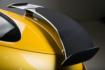 Close up of rear carbon fibre spoiler of sports car