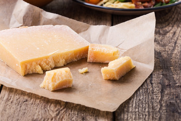 Parmesan cheese on rustic wooden table
