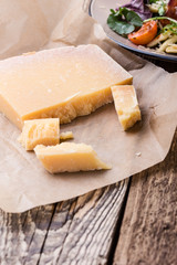 Parmesan cheese on rustic wooden table