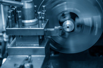 The lathe machine bore cutting the metal part with the cutting tool.Metal working in factory.