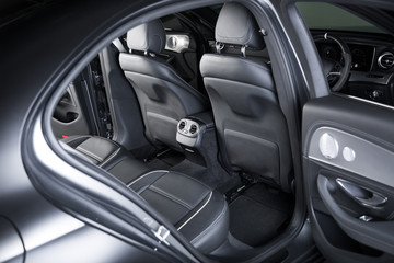 Obraz na płótnie Canvas Passenger cabin in black car interior
