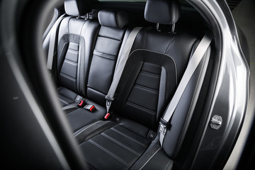 Close up of black leather passenger seats
