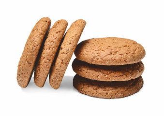 Several pieces of oatmeal cookies are hilted on top of each other. White isolated background. Close quarters. Side view.