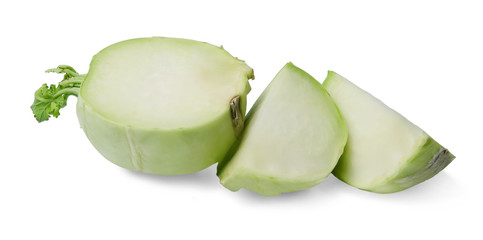 Half a kohlrabi cabbage and two quarters on a white isolated background. Close-up. Side view.