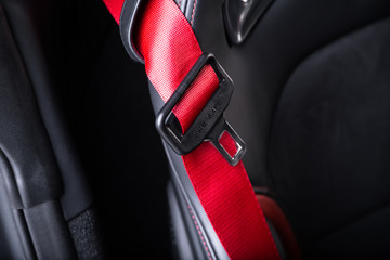Close up of red seat belt in sports car