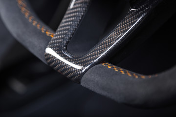 Close up of carbon fibre car steering wheel