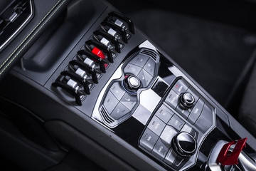 Control panel with buttons in sports car interior