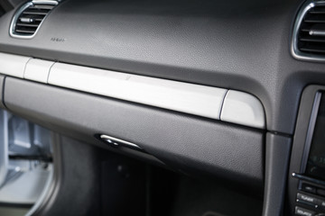 Close up of closed storage compartment in car