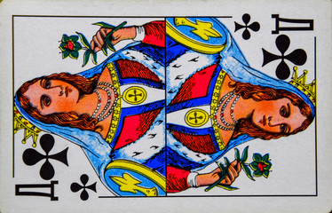 Card playing queen of clubs, suit of clubs.