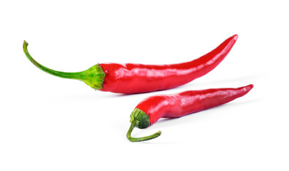 Red chili peppers, cut out and isolated on white background. Hot spice, red chili peppers. Top view...