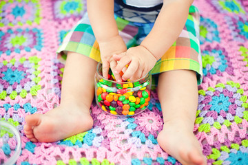baby holding sweets