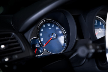 Blue speedometer in car