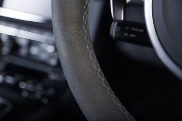 Close up of steering wheel stitching