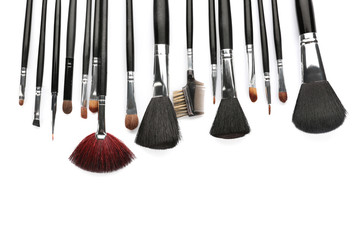 Set of makeup brushes on white background