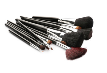 Fototapeta premium Set of makeup brushes on white background