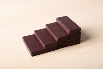 Stacked blocks on wooden table. Concept of career