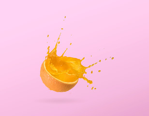 Fototapeta na wymiar Slice of orange, orange juice splash isolated on plain background