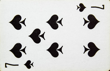 Obraz na płótnie Canvas Card playing seven peak suit of spades.