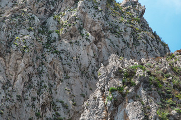 Fototapeta na wymiar Close up on rocks on Capri island coast. Italy.