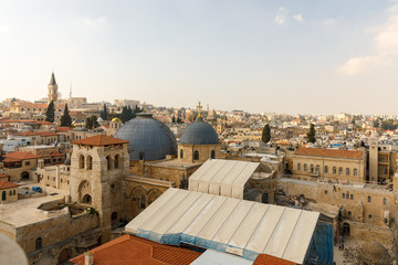 Fototapeta na wymiar Wide view from top on two domes and belfry of the Church of the Holy Sepulchre in Jerusalem