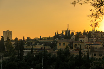 Jerusalem's quarters outside old city walls at sunset