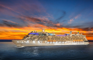 Fototapeta na wymiar Luxury cruise ship sailing to port on sunset. 