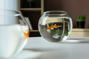 Glass fishbowls on table