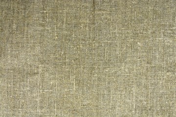 The dense texture of the old burlap, a fabric made of flax