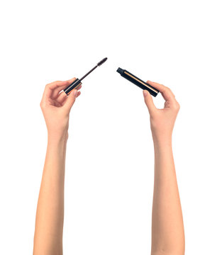 mascara brush in women hends isolated, make up concept