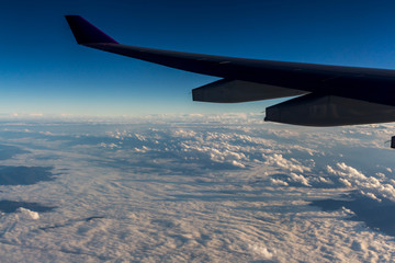 Naklejka na ściany i meble Clouds sky looking from the plane