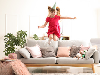 Jumping little girl at Birthday party