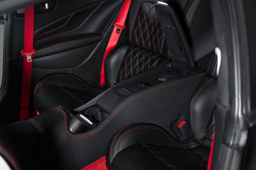 Black passenger seats in luxury sports car interior