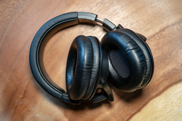 Fototapeta na wymiar headphones on wooden background