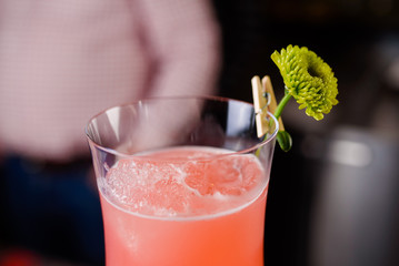 Expert barman is making cocktail at night club, Barman holds a cocktail in his hand. No face. Selective focus