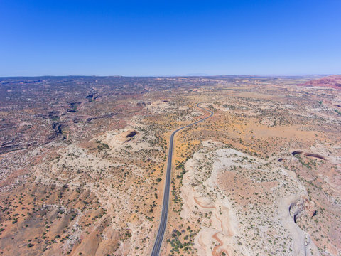 Mesa and canyon landscape and Utah State Route 313 aerial view near Arches National Park, Moab, Utah, USA.