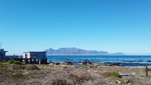A slow track-in towards Table Mountain from Robben Island.
