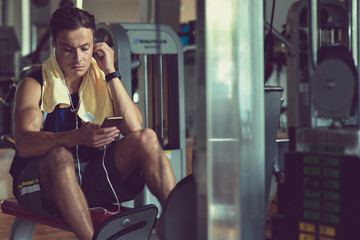 Fit man choosing music