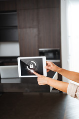 selective focus of digital tablet with smart home security lock illustration in female hands
