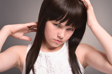 Naklejka premium Portrait of girl with dark hair posing
