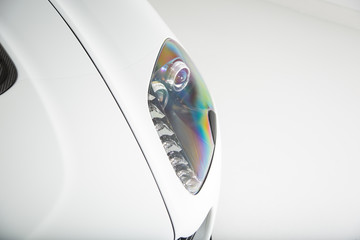 Close up of white car headlight
