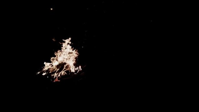 A campfire burns brightly.
